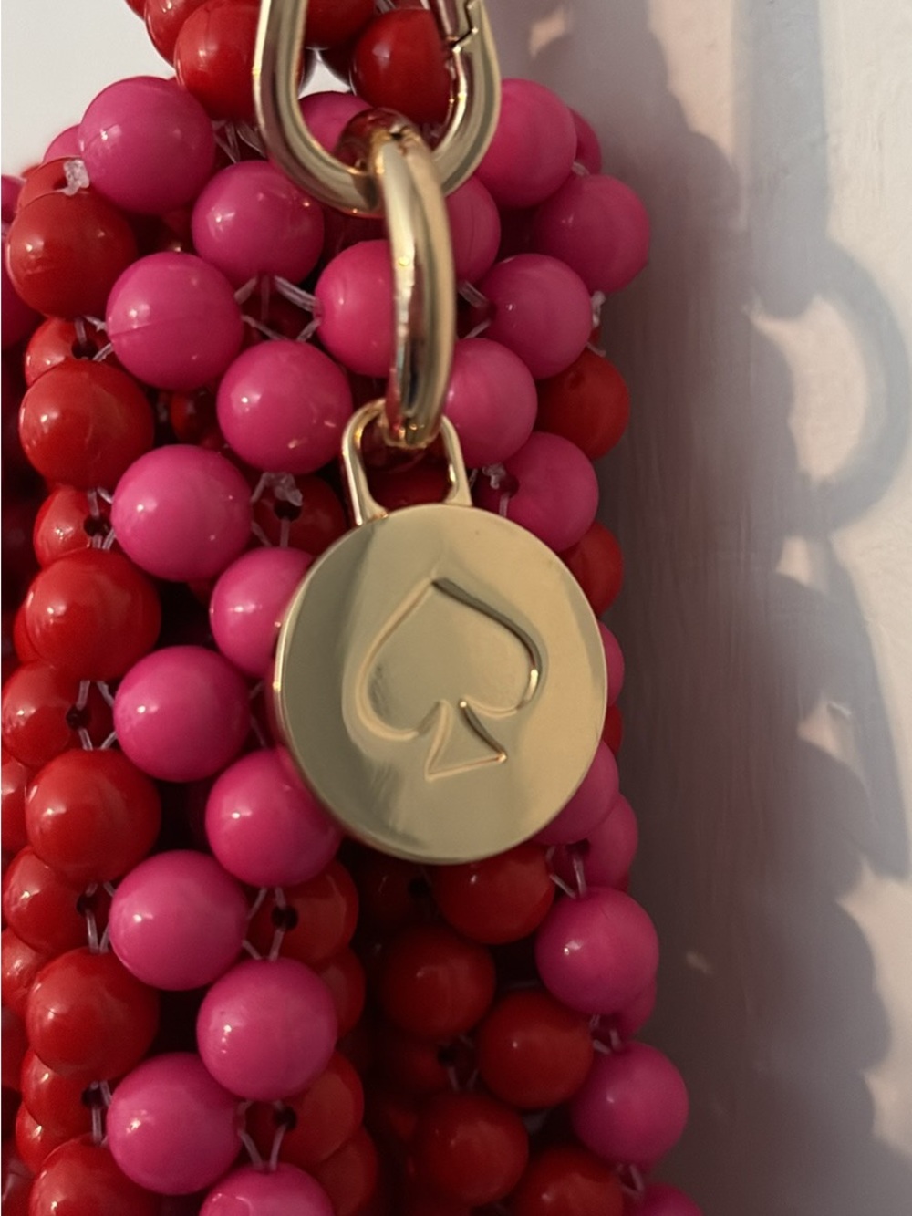kate spade Pink and Red Beaded purse with Gold Spade Charm